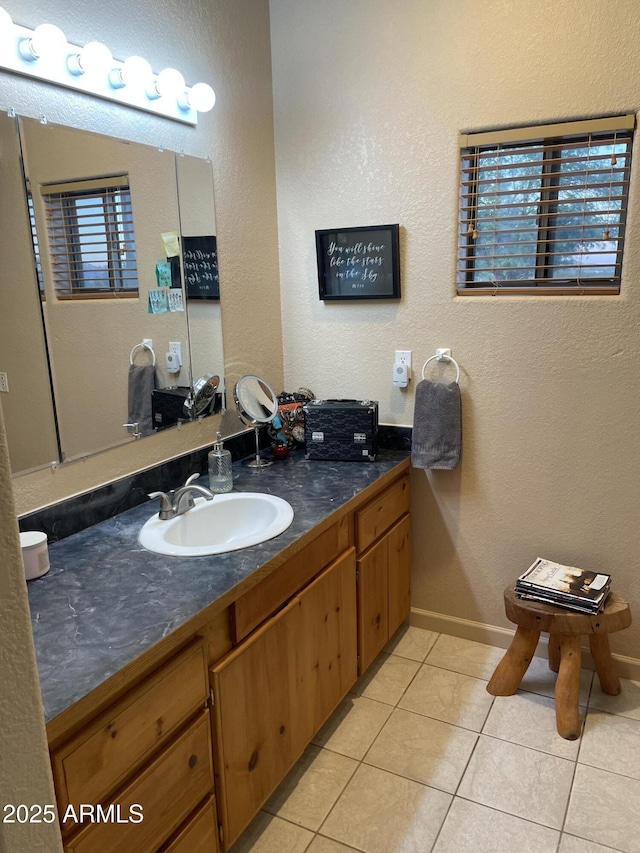 39281 Ave 61 Unit 1/2, Salome, AZ 85348 - bathroom with tile patterned floors, vanity, baseboards, and a textured wall