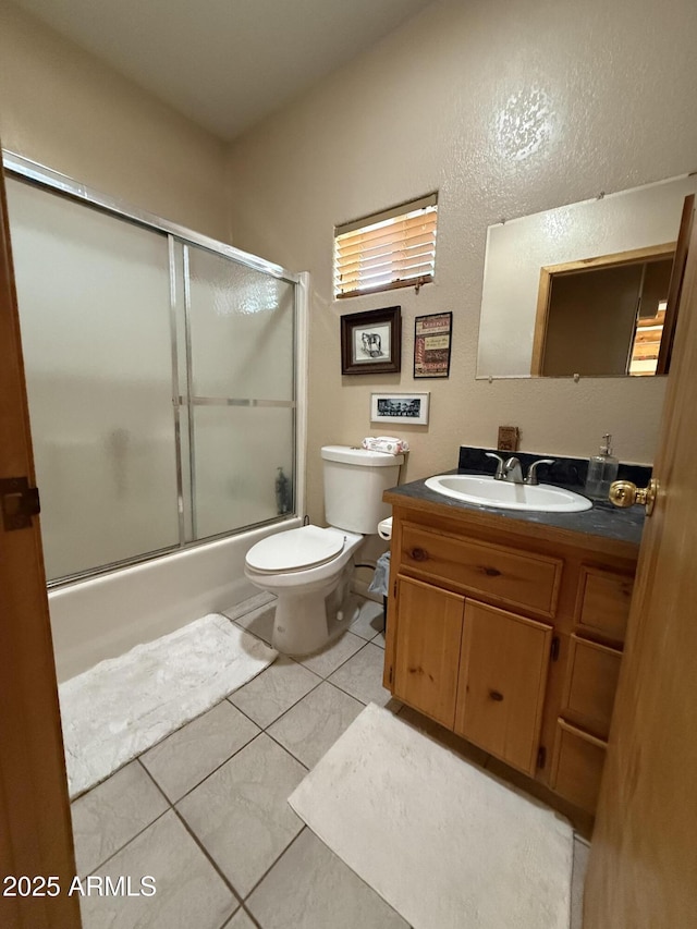 39281 Ave 61 Unit 1/2, Salome, AZ 85348 - bathroom with toilet, vanity, shower / bath combination with glass door, and tile patterned floors