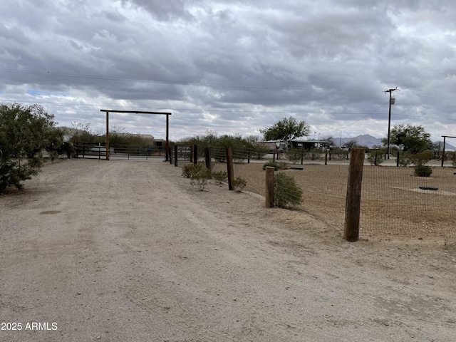 39281 Ave 61 Unit 1/2, Salome, AZ 85348 - view of dirt / gravel road featuring a gated entry
