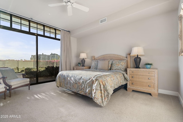 carpeted bedroom featuring ceiling fan, floor to ceiling windows, and access to outside