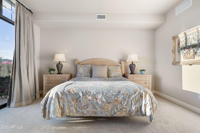 bedroom with light colored carpet