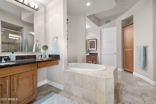 bathroom featuring vanity and plus walk in shower