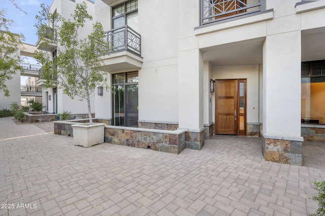 doorway to property with a balcony