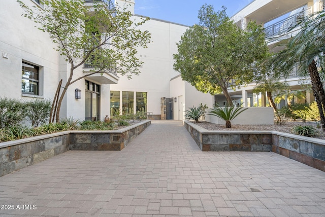 view of property's community with a patio area