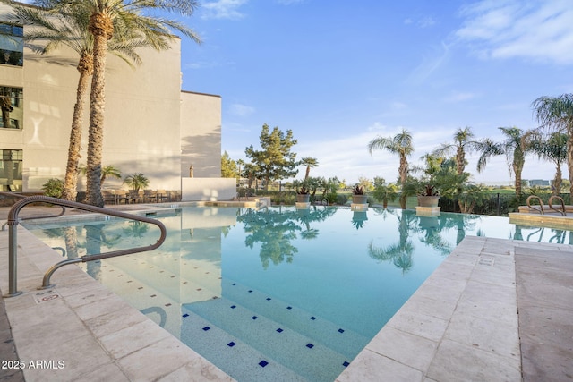 view of swimming pool with a patio area