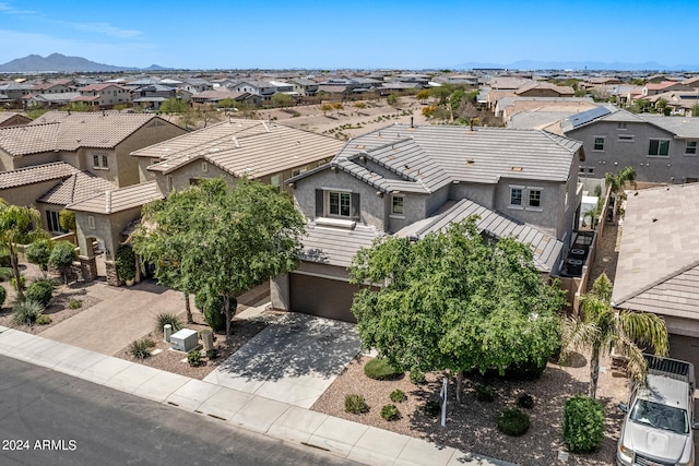 birds eye view of property featuring a mountain view