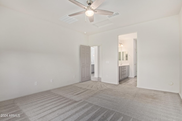 unfurnished room featuring light colored carpet and ceiling fan