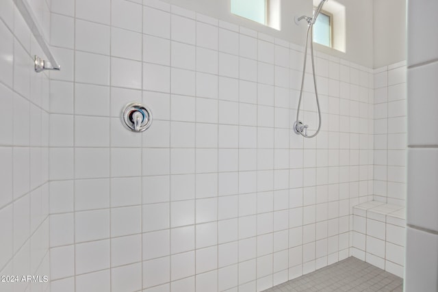 bathroom featuring tiled shower