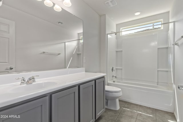 full bathroom with tile flooring, toilet, vanity, and shower / bath combination