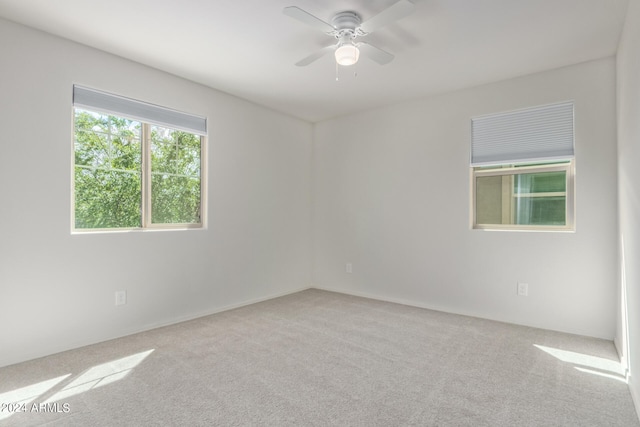 carpeted empty room with ceiling fan