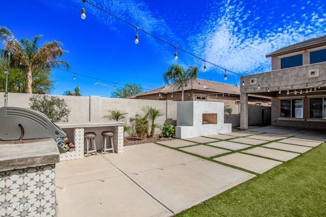 view of patio featuring exterior kitchen