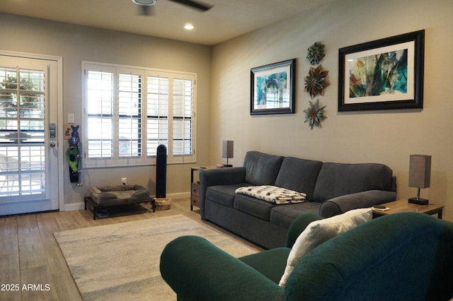 living area featuring ceiling fan, baseboards, wood finished floors, and recessed lighting