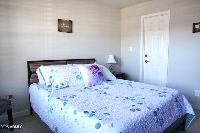 bedroom featuring carpet floors and baseboards