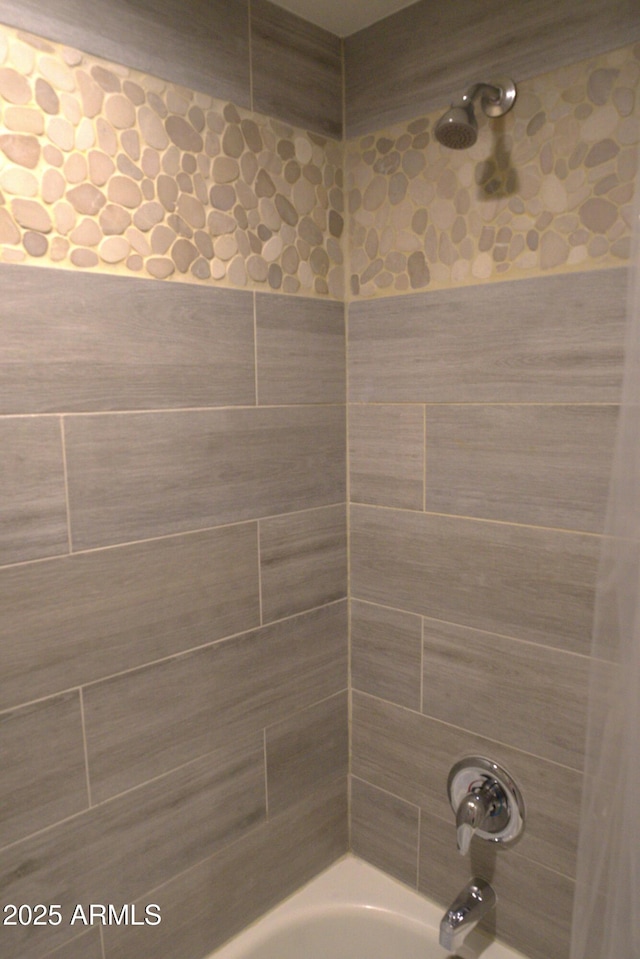 full bath featuring shower / washtub combination