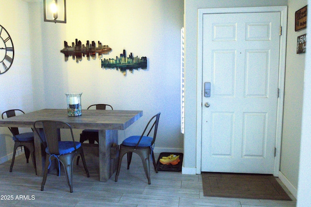 dining room with baseboards