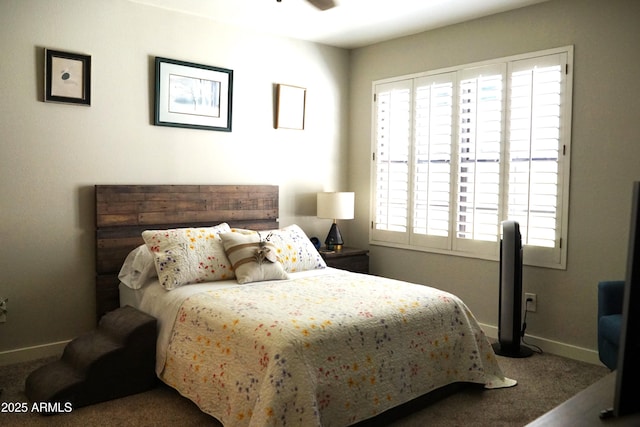 bedroom featuring carpet flooring and baseboards