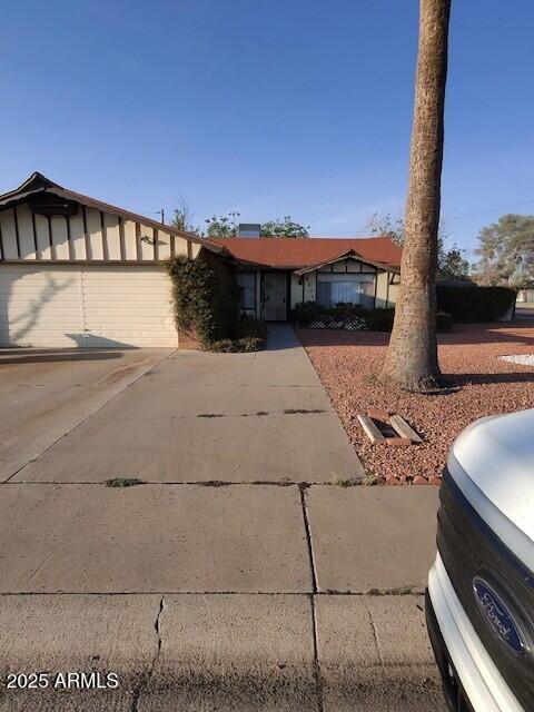 8401 E San Miguel Ave, Scottsdale, AZ 85250 - single story home featuring an attached garage and concrete driveway