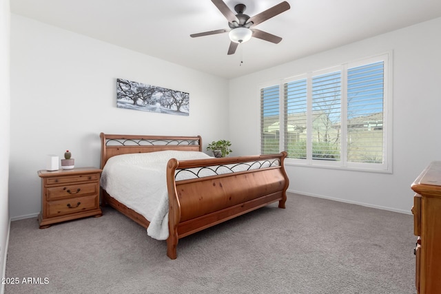 bedroom featuring ceiling fan and light carpet