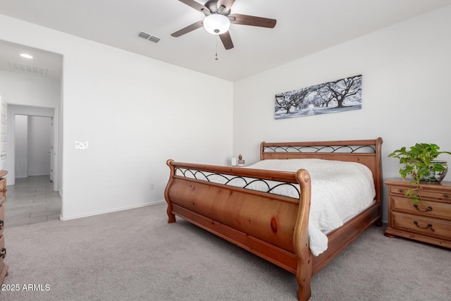 bedroom featuring ceiling fan and light carpet