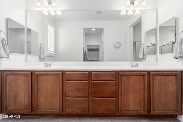 bathroom featuring vanity and an inviting chandelier