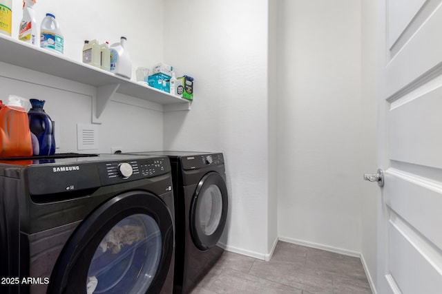 clothes washing area with independent washer and dryer