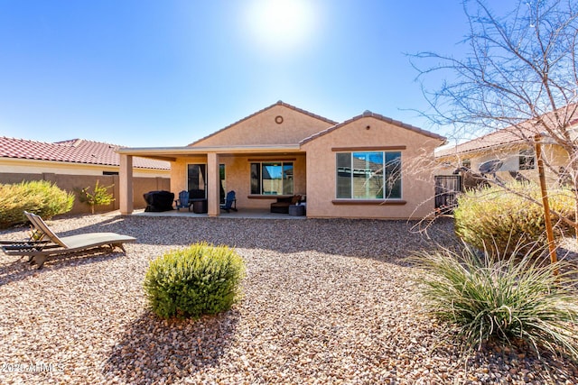 rear view of property with a patio area