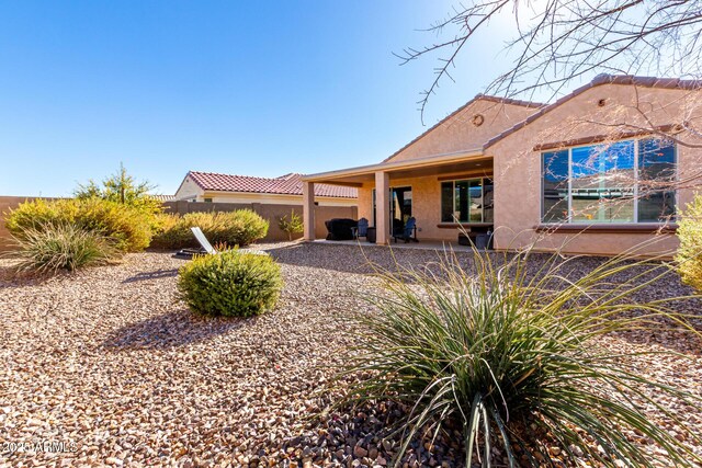 back of house featuring a patio area