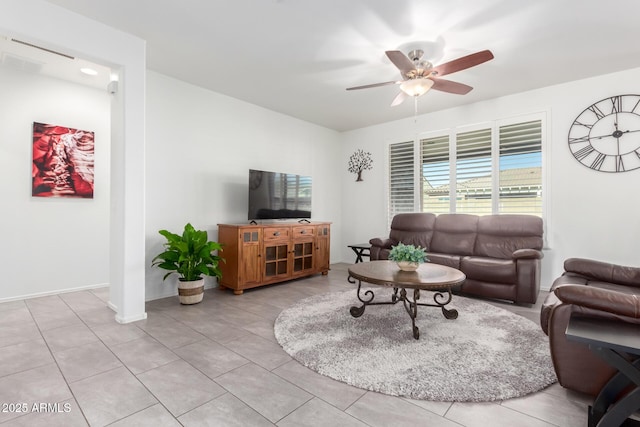 living room featuring ceiling fan and light tile patterned floors