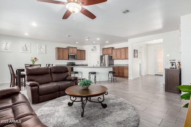 living room featuring ceiling fan