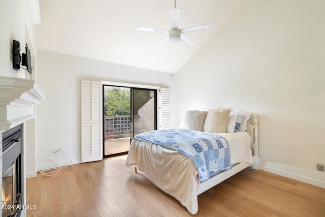 bedroom with access to exterior, ceiling fan, high vaulted ceiling, and light wood-type flooring