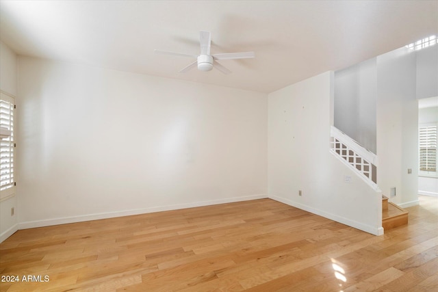 unfurnished room featuring light hardwood / wood-style flooring and ceiling fan