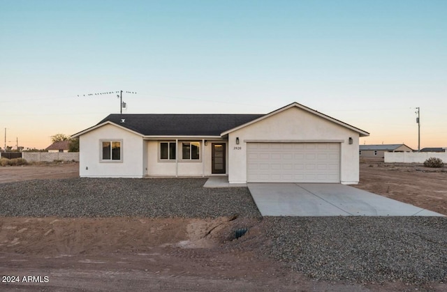 ranch-style home featuring a garage