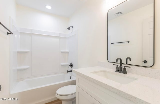 full bathroom with toilet, vanity, and bathing tub / shower combination