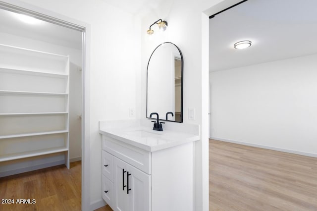 bathroom featuring vanity and hardwood / wood-style flooring