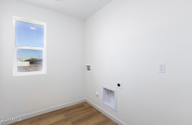 washroom with electric dryer hookup, hookup for a washing machine, and hardwood / wood-style flooring