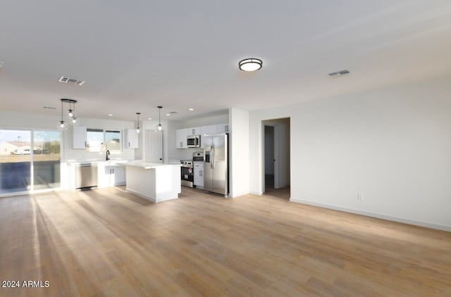 unfurnished living room with light hardwood / wood-style floors