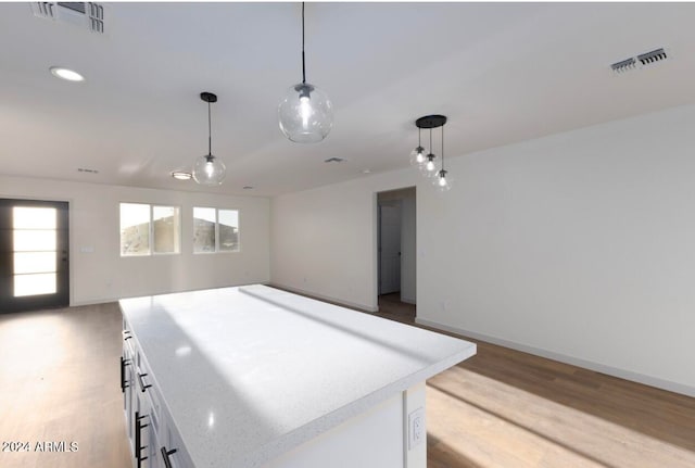 spare room featuring light hardwood / wood-style flooring