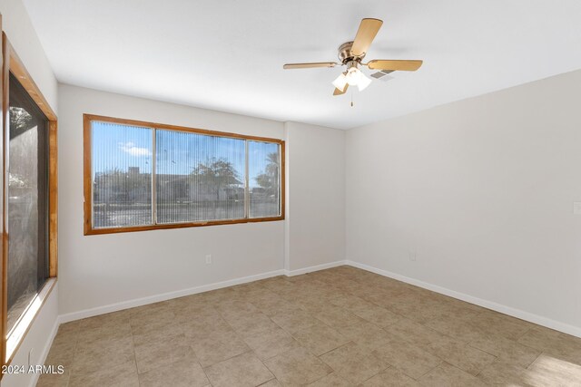 spare room featuring ceiling fan