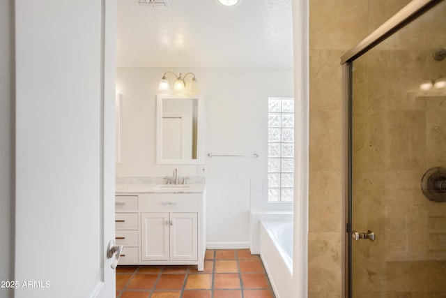 full bathroom with a stall shower, vanity, a bath, and tile patterned flooring