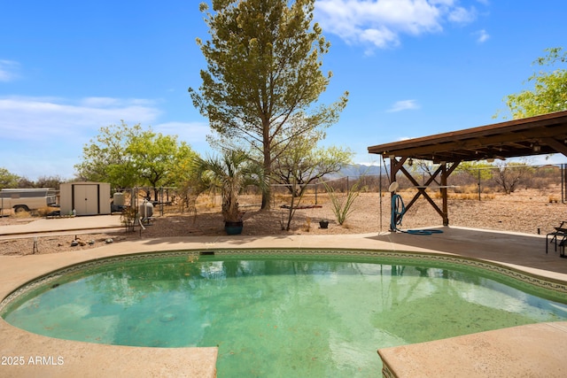 view of pool featuring a patio, a fenced in pool, and a fenced backyard