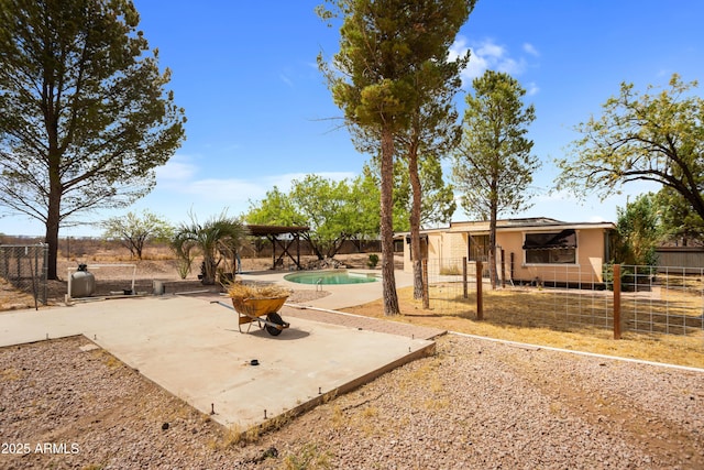 view of yard featuring a fenced backyard, a patio, and a fenced in pool