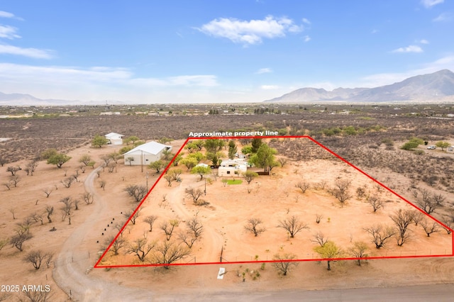 birds eye view of property with a mountain view, a desert view, and a rural view