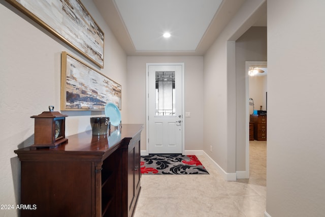 entrance foyer featuring light colored carpet