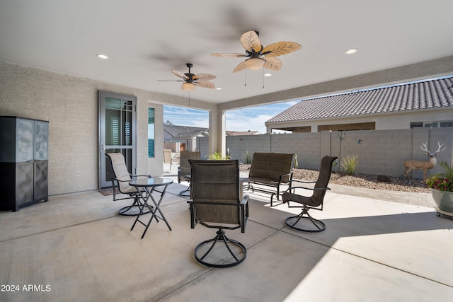 view of patio featuring ceiling fan