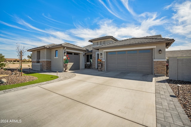 prairie-style home featuring a garage