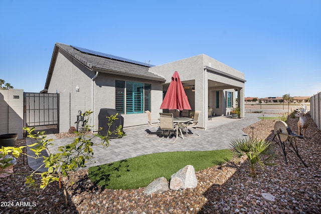 rear view of house featuring a patio