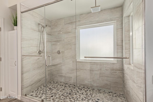 bathroom featuring a shower stall