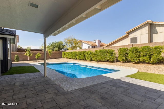 view of pool with a patio area, a fenced in pool, and a fenced backyard