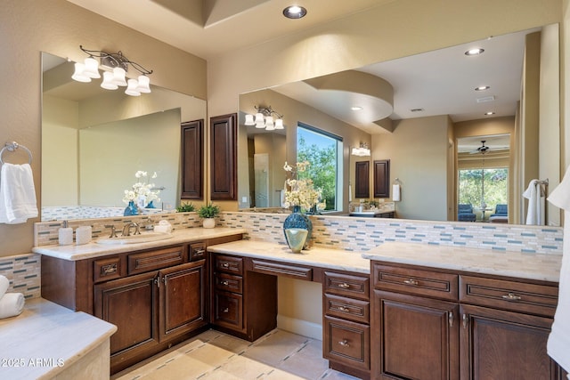 bathroom with tile patterned floors, recessed lighting, vanity, and decorative backsplash