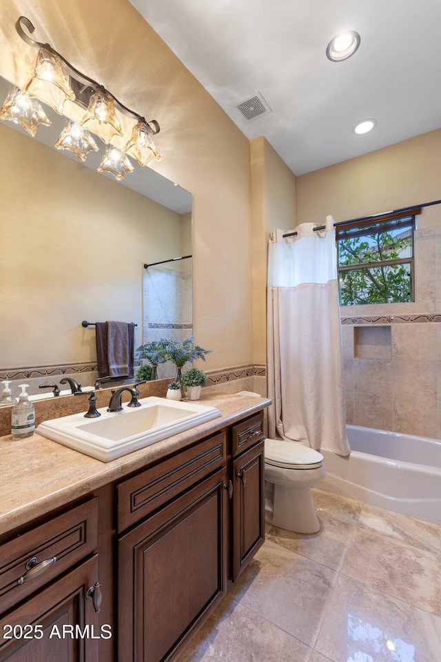 full bathroom with visible vents, toilet, shower / bath combination with curtain, recessed lighting, and vanity